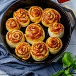rolls made with pepperoni and cheese in a black cast iron pan