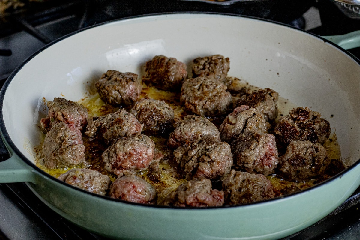 cooked meatballs in a large saucepan