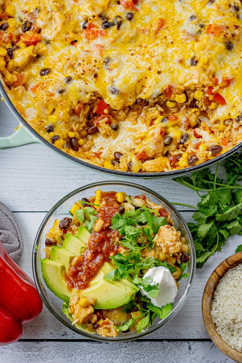 Burrito bowls are such a simple and easy one pot meal, loaded with tender chicken, vibrant red peppers and flavorful onions combined with black beans, fluffy rice and colorful corn.
