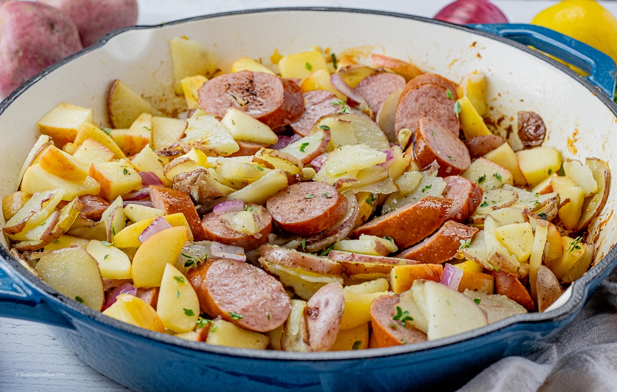 cooked turkey sausage and thinly sliced potatoes and apples in a large skillet