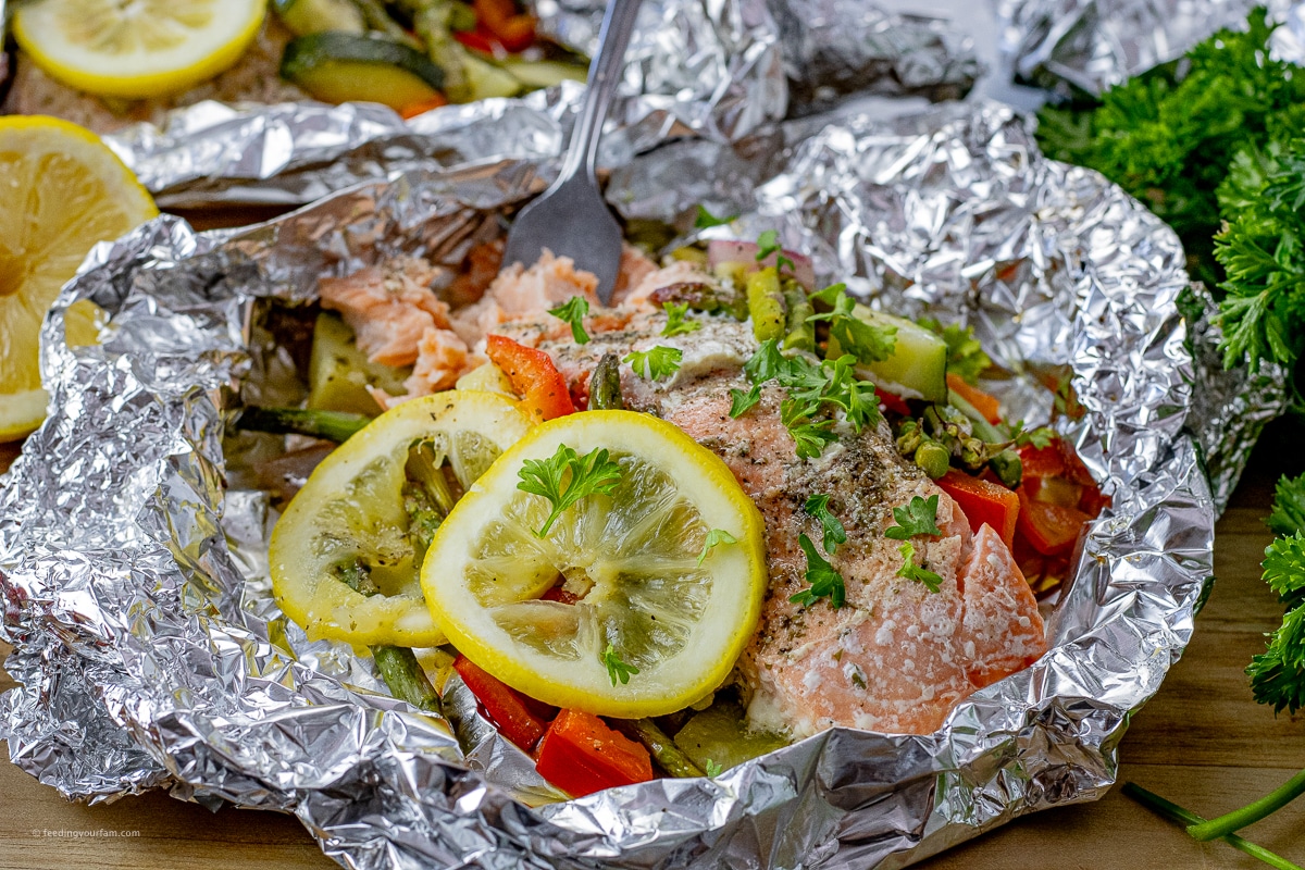 salmon with a fork in it in a sheet of foil