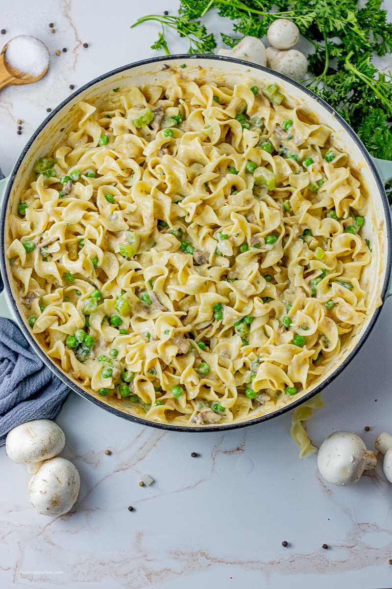 egg noodles in a creamy mushroom sauce with green peas and tuna