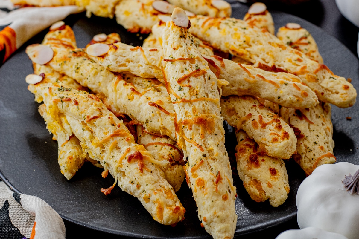 cheesy fingers made into witch fingers with slivered almond fingernails