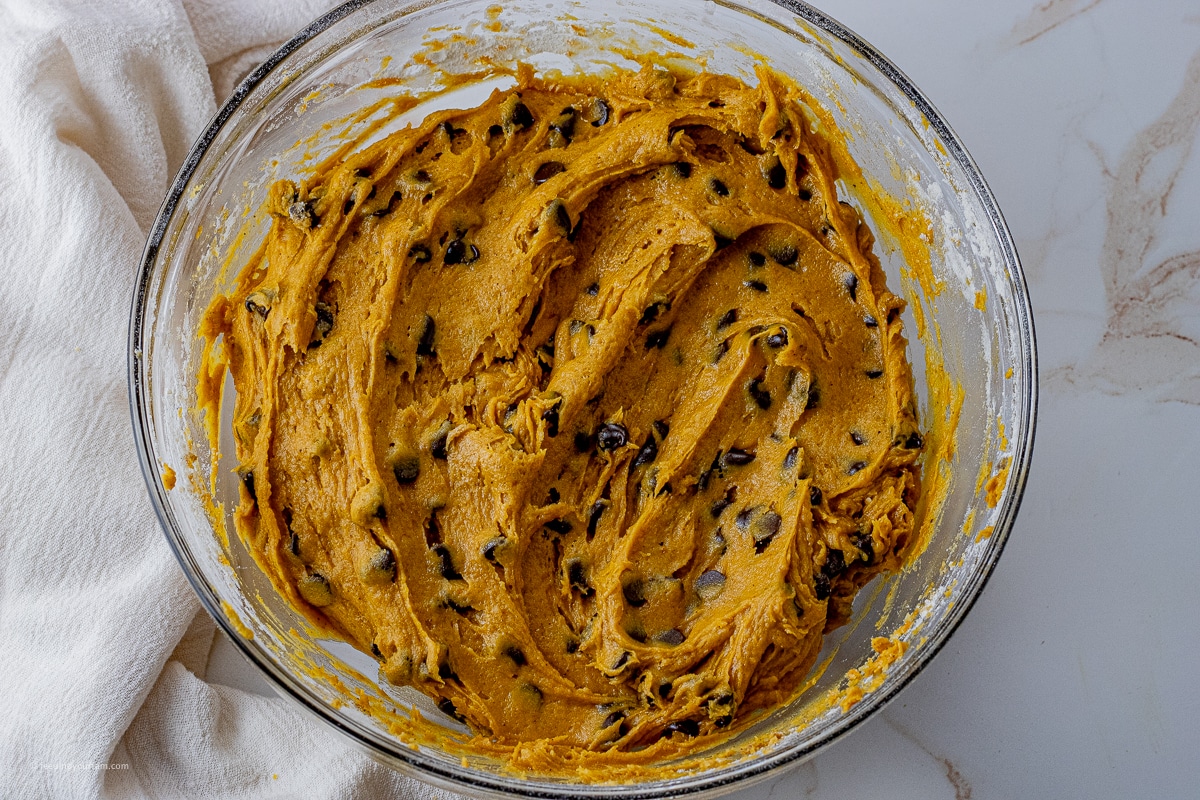 pumpkin bar batter with chocolate chips in a glass mixing bowl