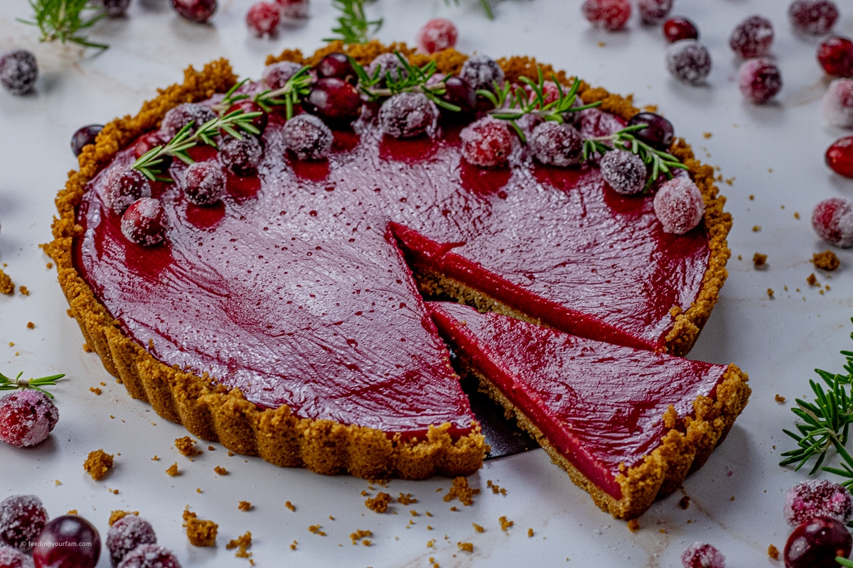 graham cracker crust filled with cranberry curd and topped with sugared cranberries