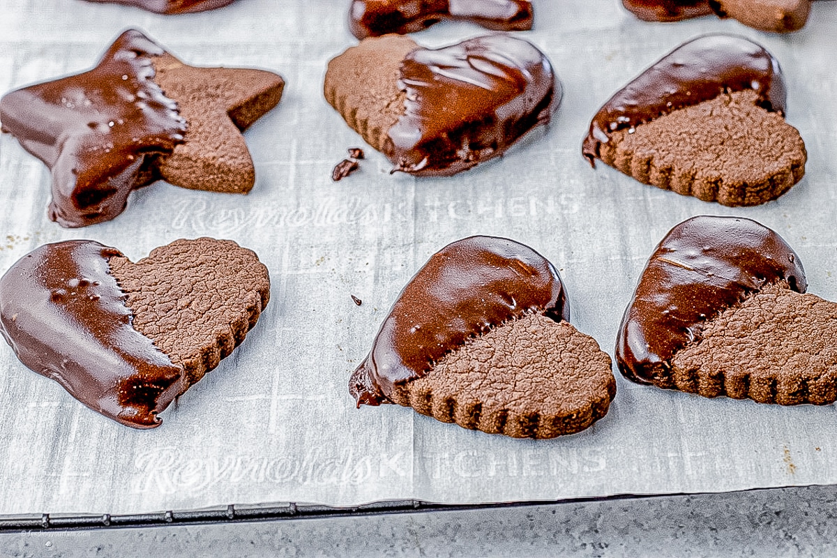 heart and star chocolate cut out cookies with half dipped in chocolate