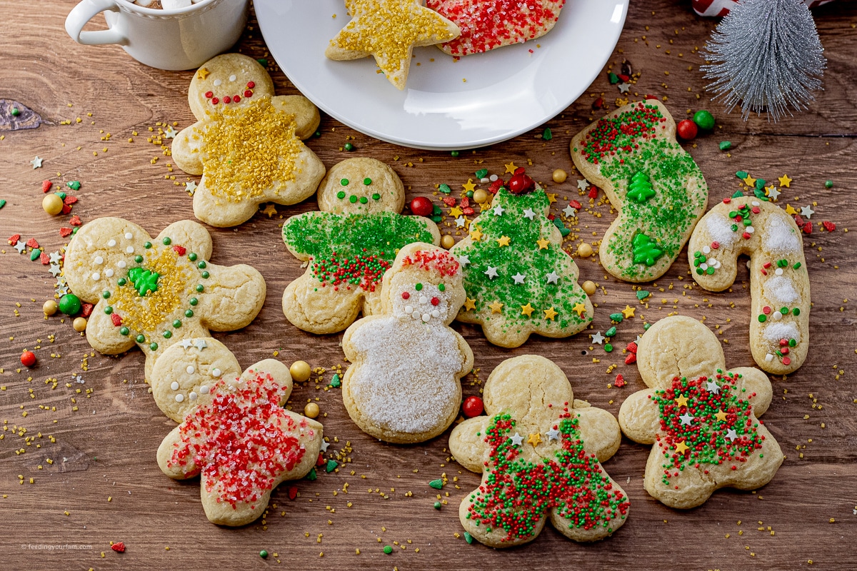 cut out Christmas cookies decorated with sprinkles
