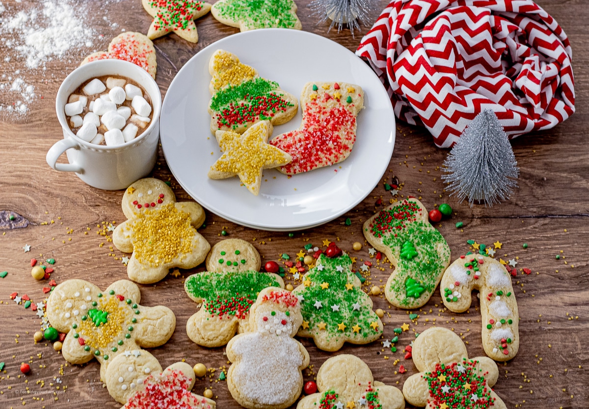 cut out christmas cookies decorated with sprinkles
