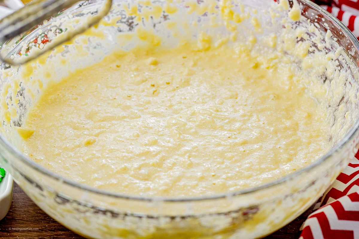 creamed together butter, sugar and eggs to make cookie dough