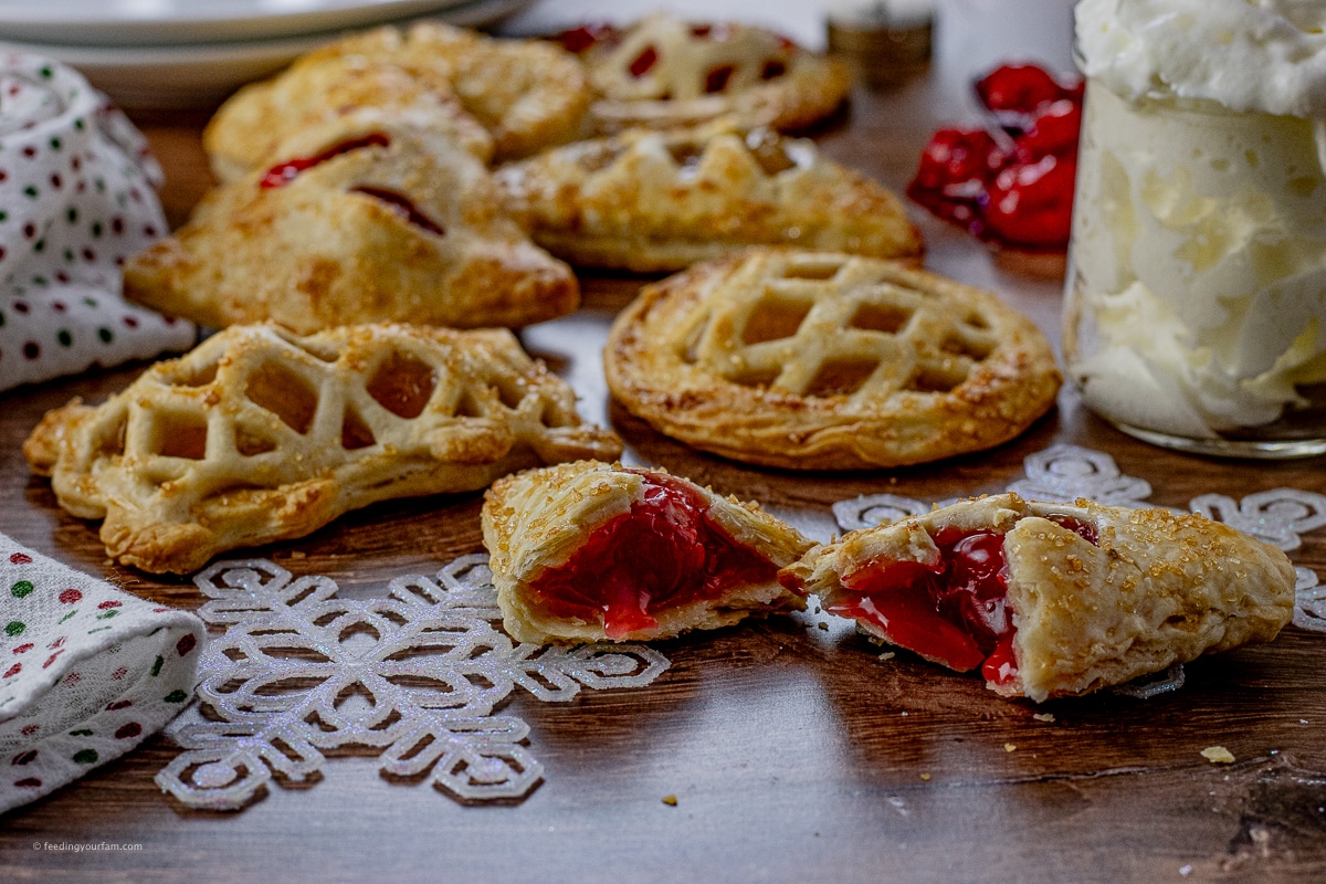 small hand pies on a table with one pie broken in half 