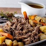 shredded beef on a platter with vegetables
