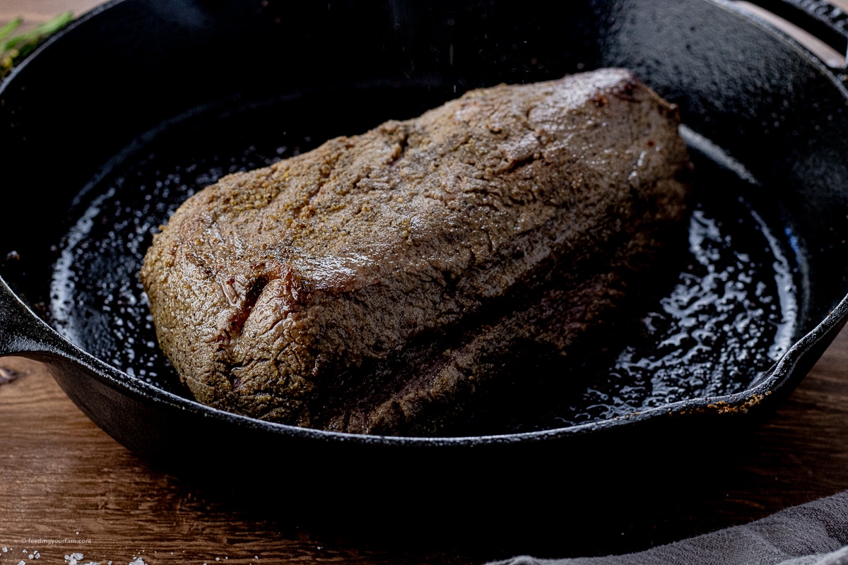 browned beef tenderloin in a cast iron pan