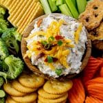 ranch dip made with cream cheese surrounded by creackers and vegetables