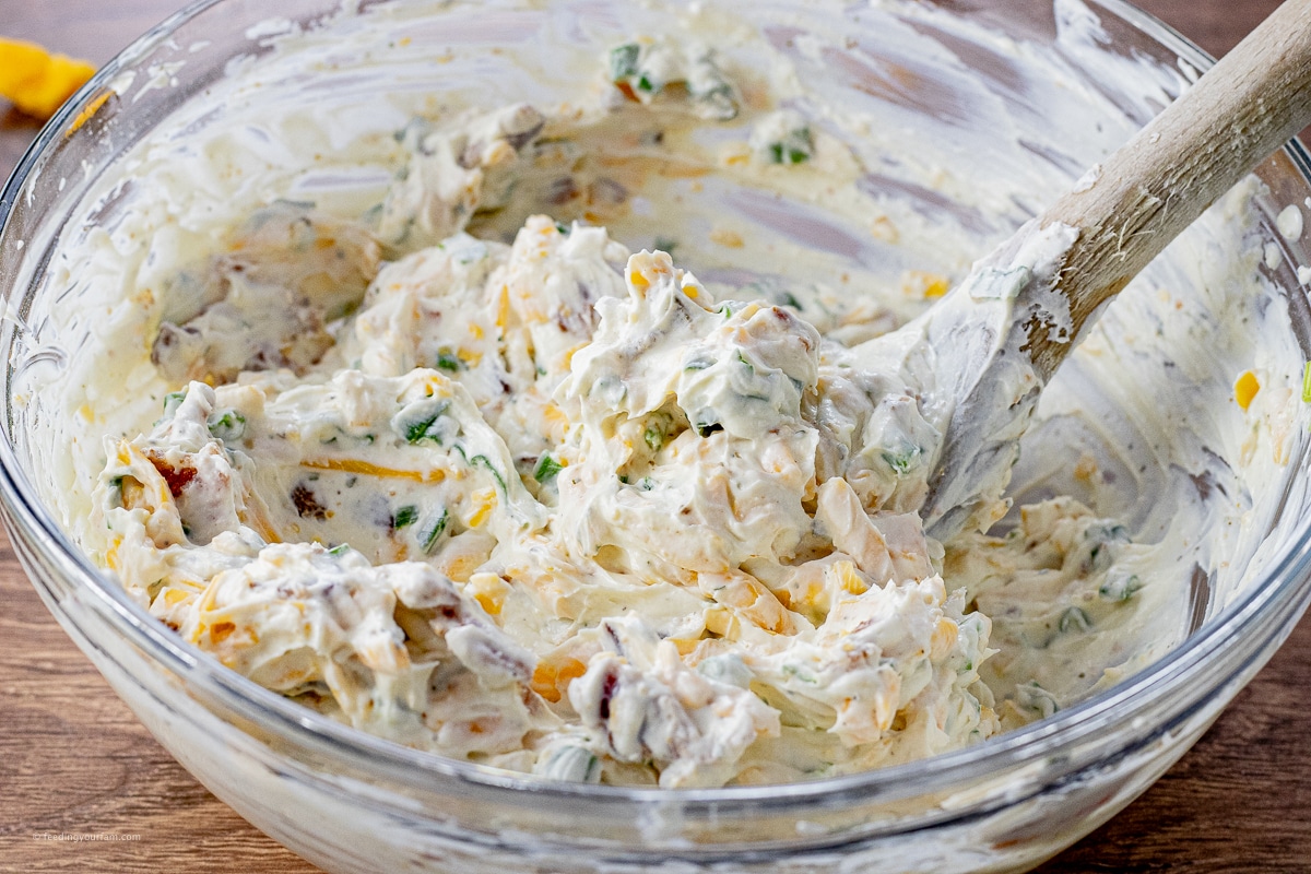 ranch dip made with cream cheese and shredded cheese in a mixing bowl