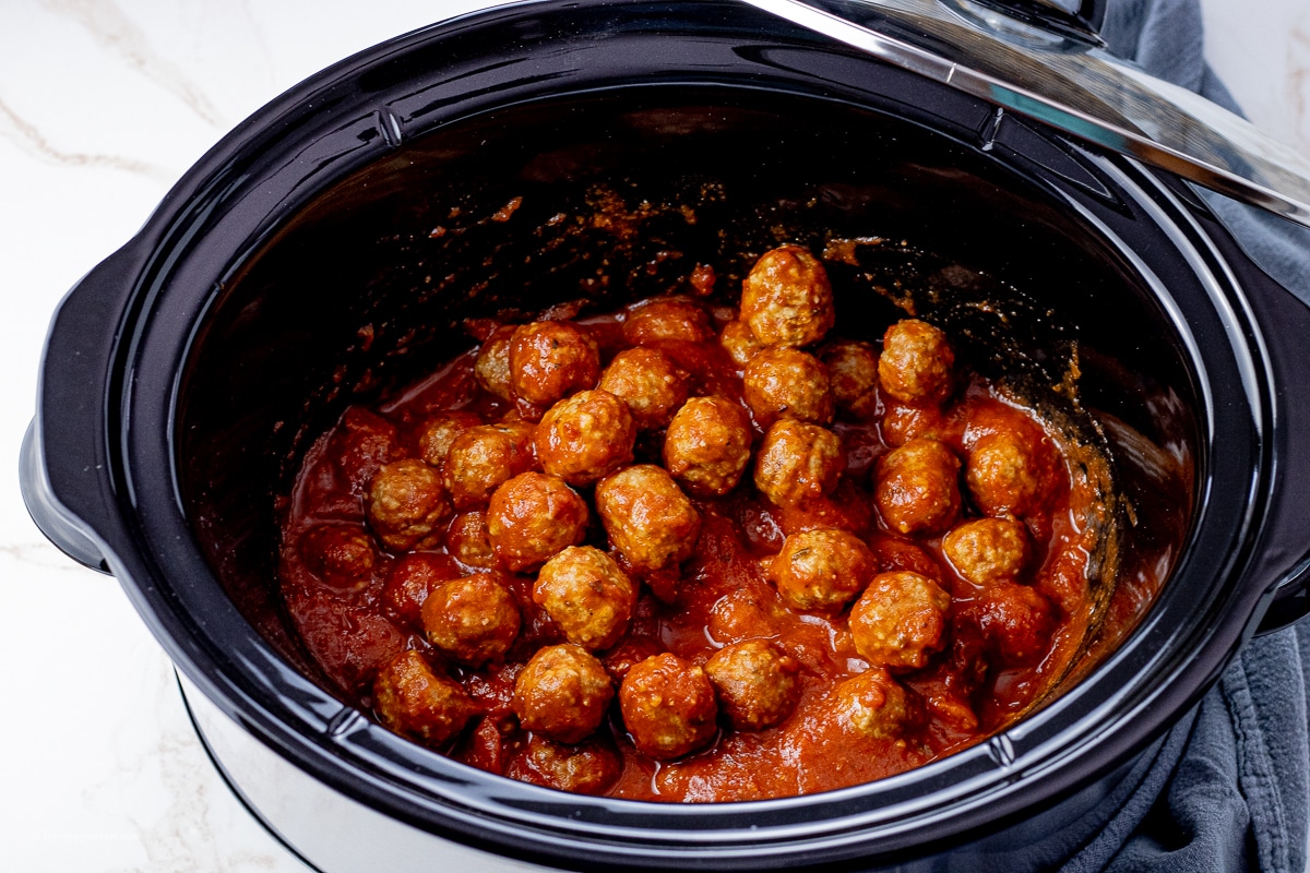 meatballs in a slow cooker in spaghetti sauce