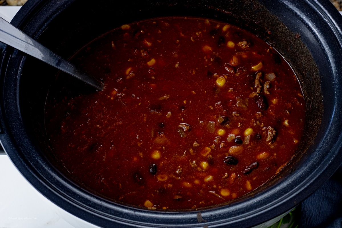 taco soup with beans and corn in a slow cooker 