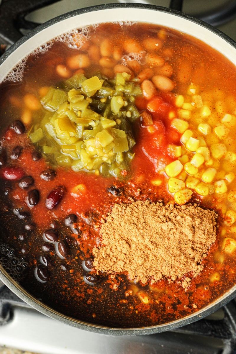 beans, corn, green chiles and taco seasoning in a pot