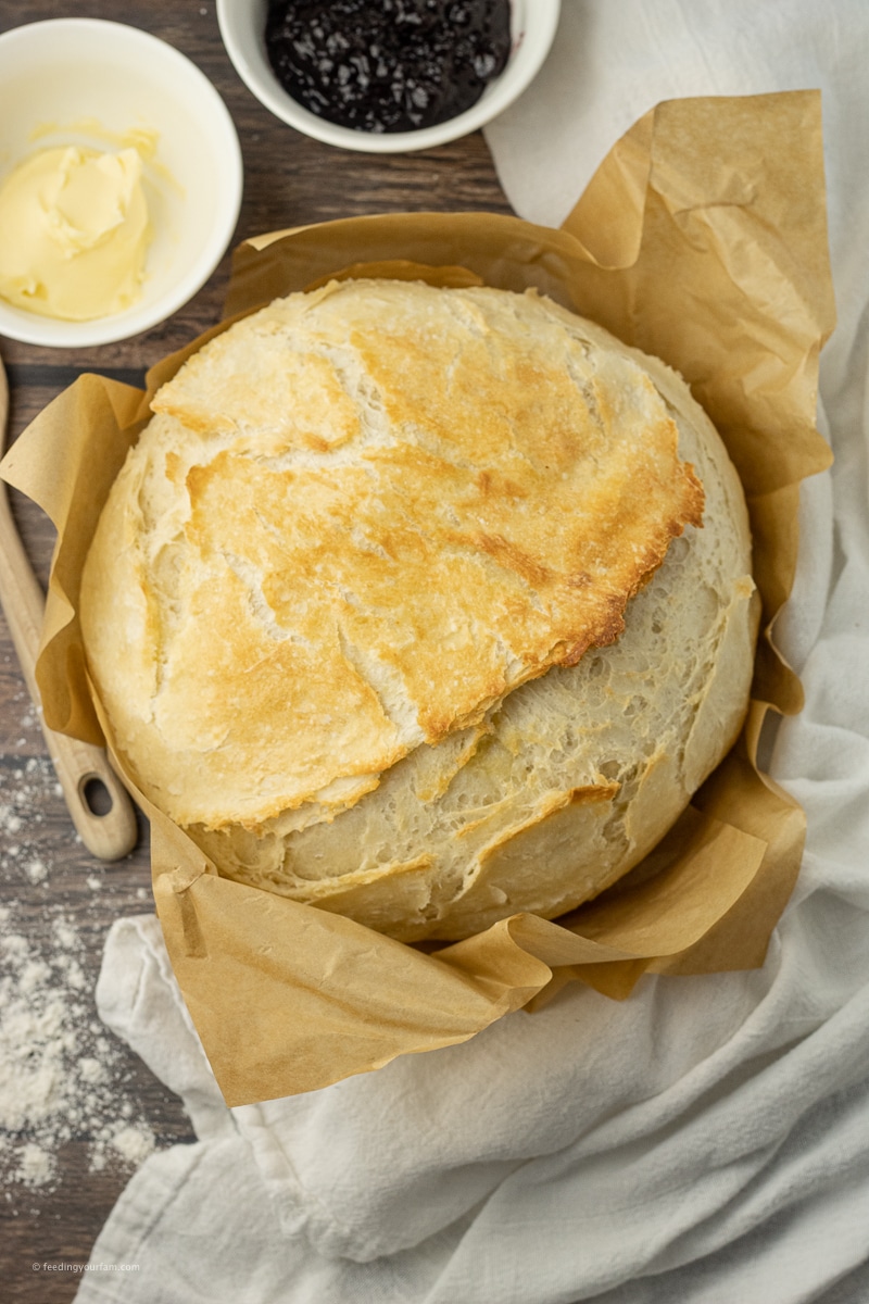 Dutch Oven Bread is the easiest way to make a crusty loaf of bread. This Easy Bread Recipe comes out crisp on the outside and perfectly soft and fluffy in the center every time.