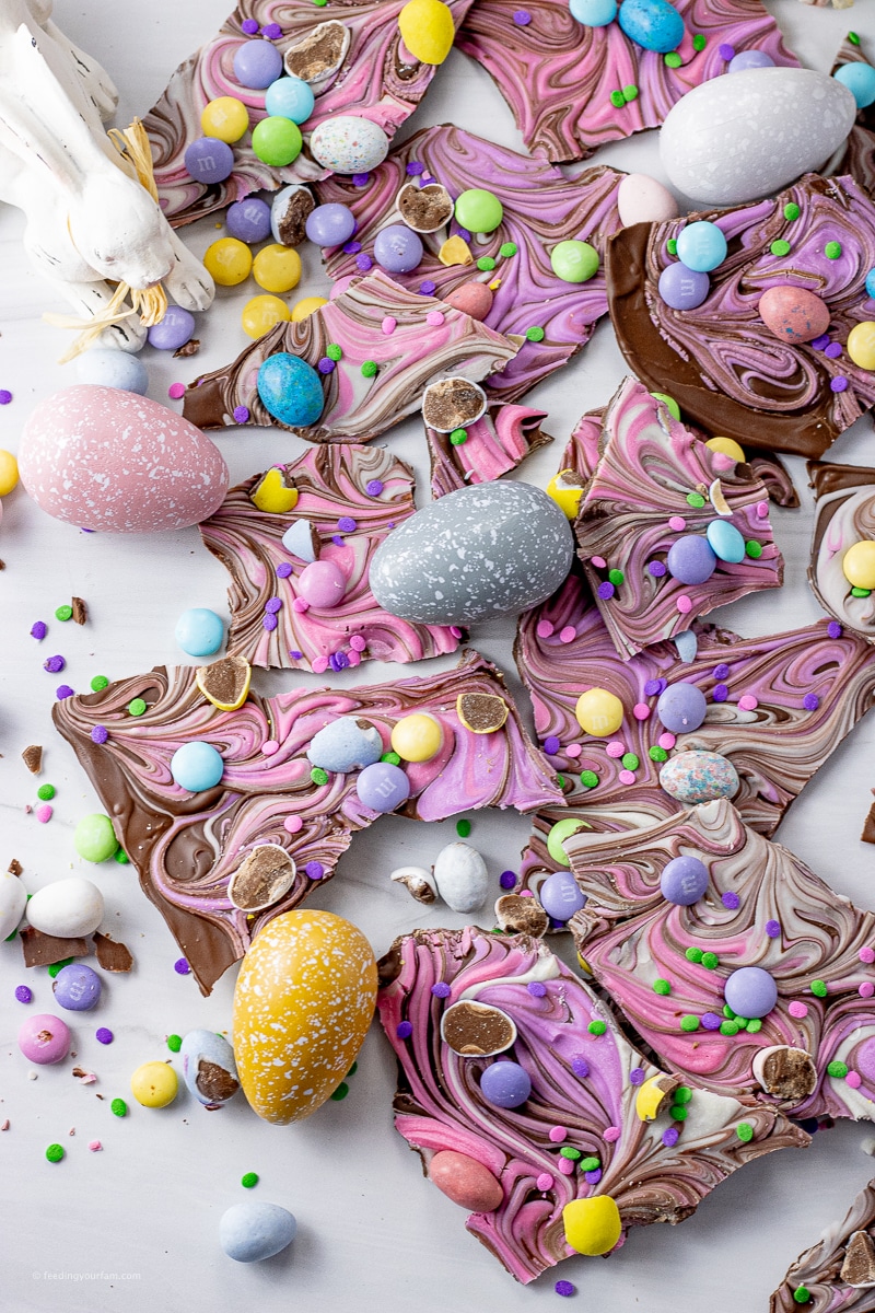 broken up pieces of chocolate bark topped with easter candies