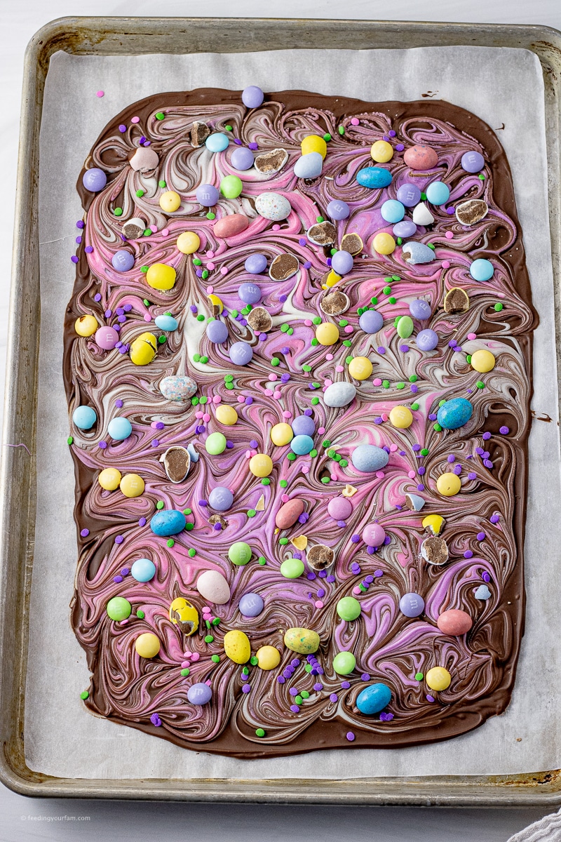 chocolate bark with swirled pastel colors and easter candies on top