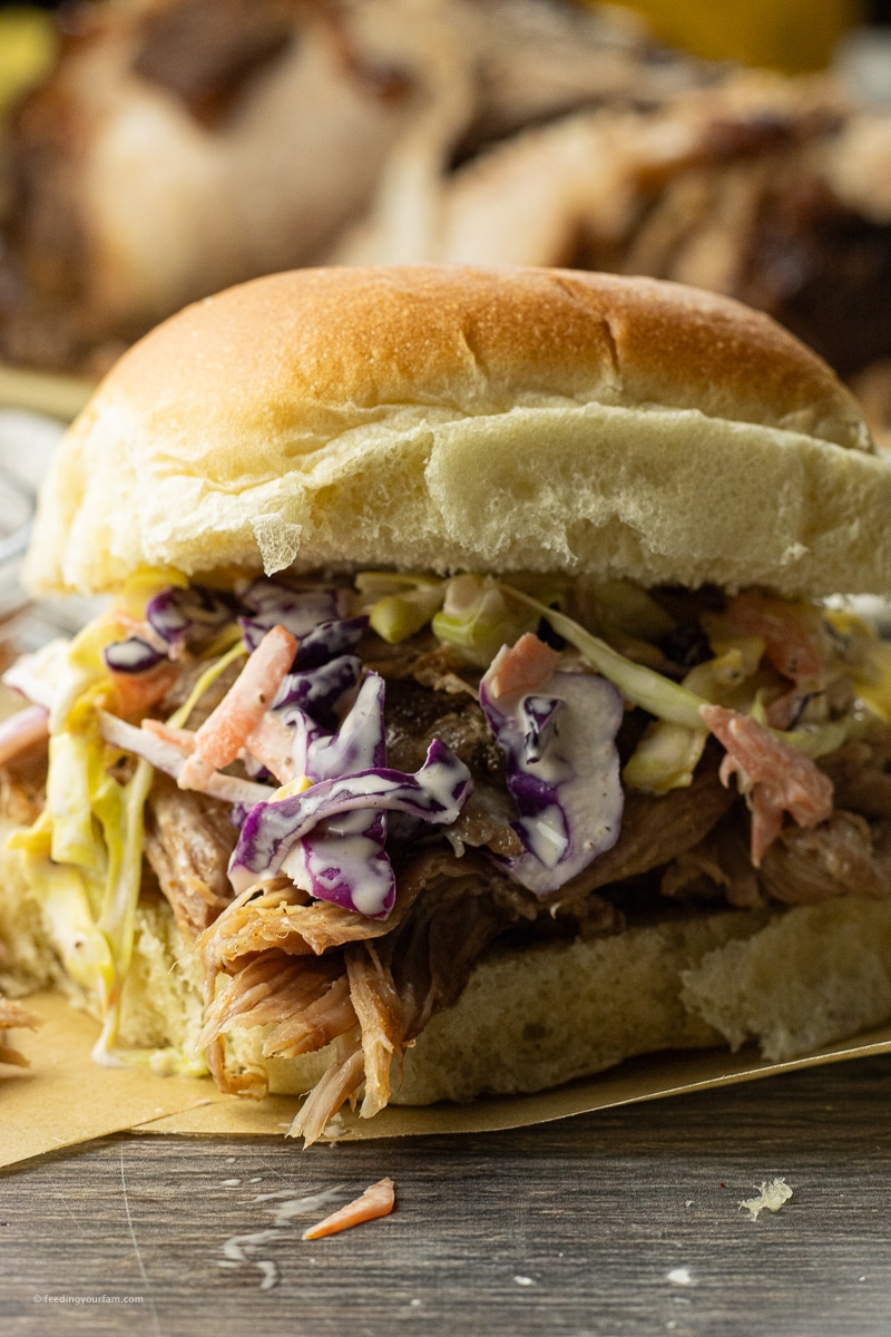 pulled pork sandwich topped with coleslaw