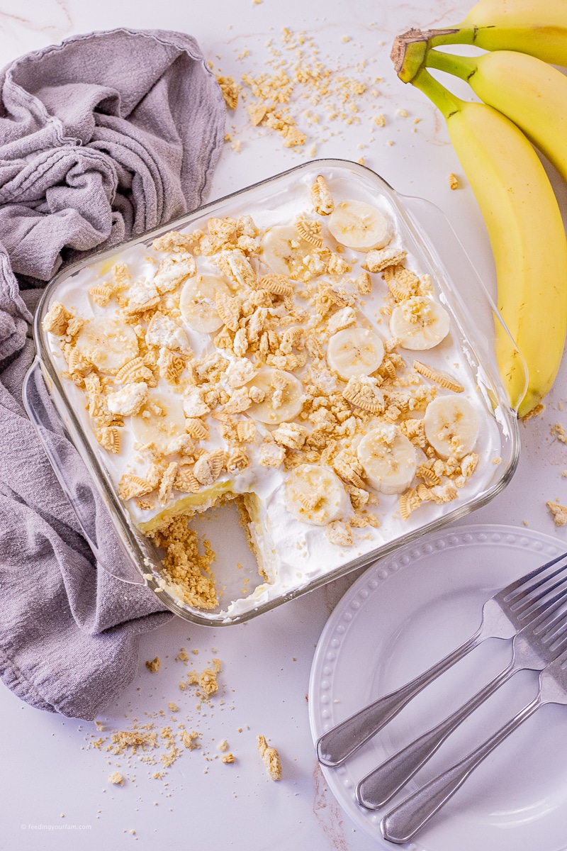 Banana Pudding Dessert is a simple layered dessert featuring a crunchy cookie crust, banana pudding, cream cheese and fresh bananas.