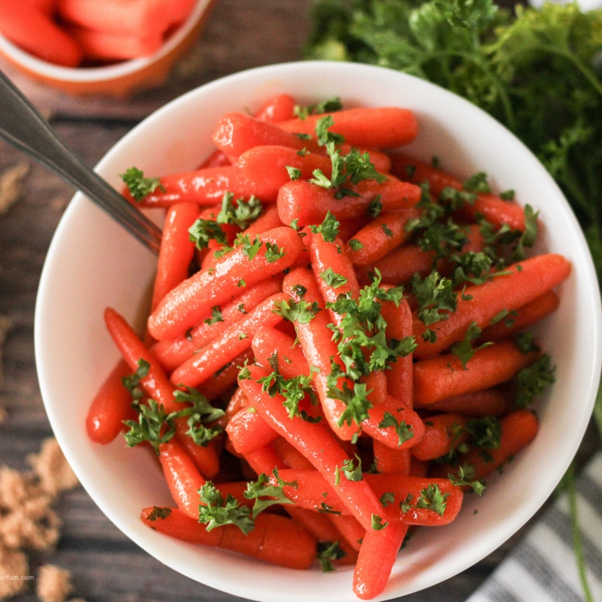 carrots cooked in a honey glaze topped with parsley