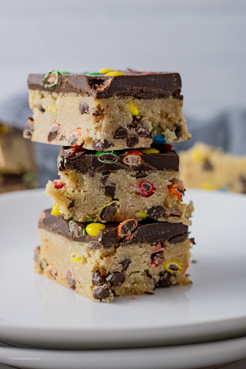 These easy No Bake Chocolate Chip Cookie Dough Bars taste just like cookie dough and come together with just 7 ingredients.