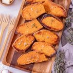 sweet potato halves baked and on a serving platter