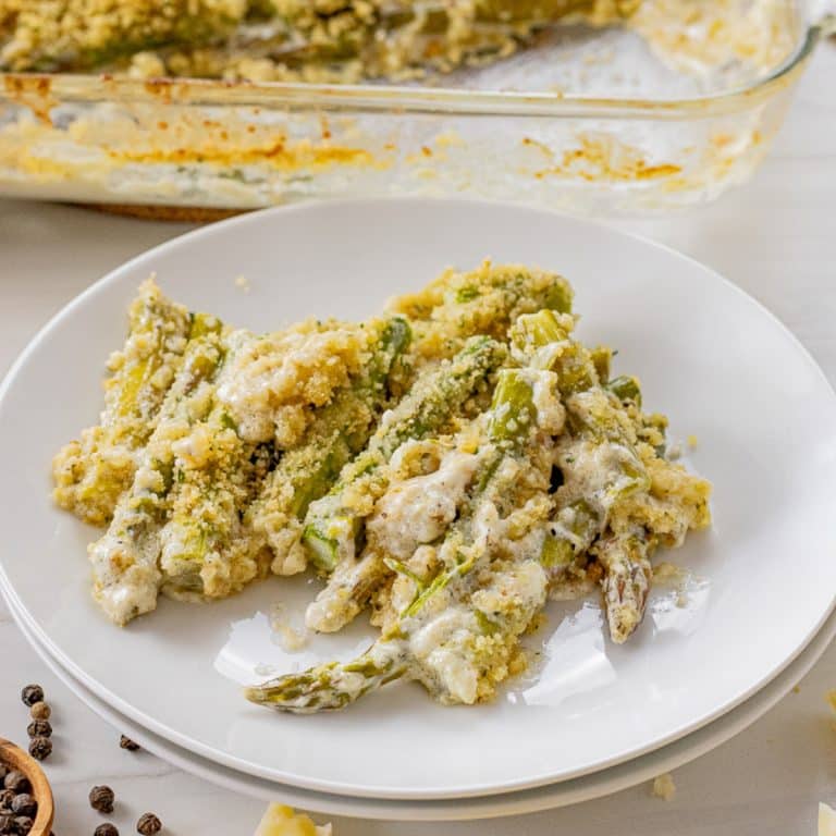 creamy asparagus in a cheese sauce with breadcrumb topping