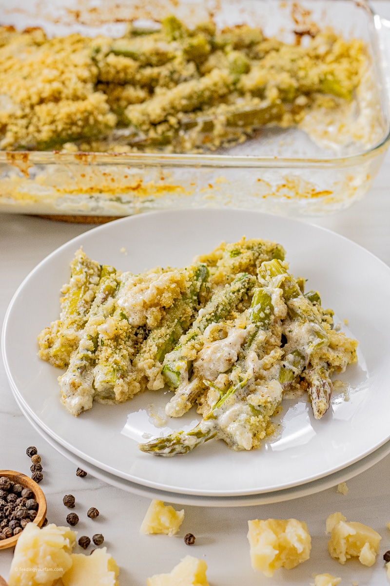 Asparagus baked in a creamy parmesan sauce and topped with a buttery breadcrumb topping to make a delicious vegetable side dish.