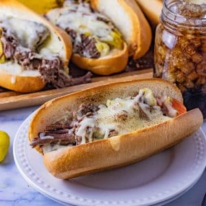 shredded beef sandwich topped with melted cheese