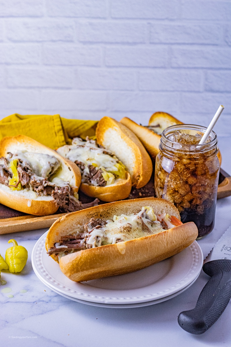 Slow Cooker Italian Beef Sandwiches are the perfect crazy day dinner. With pulled roast beef, pepperoncini, and shredded mozzarella cheese, these are always a family favorite.