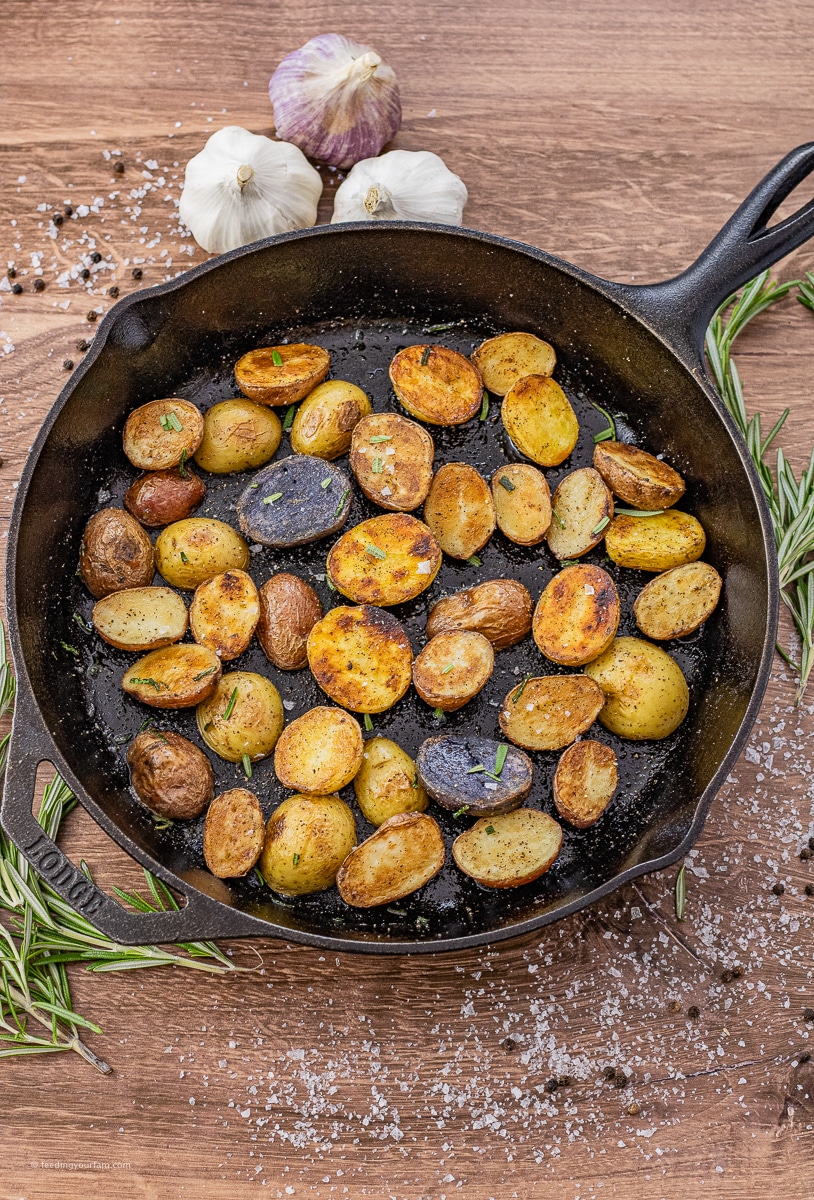 cooked baby potatoes in a cast iron pan