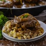onion gravy over ground beef steaks over mashed potatoes
