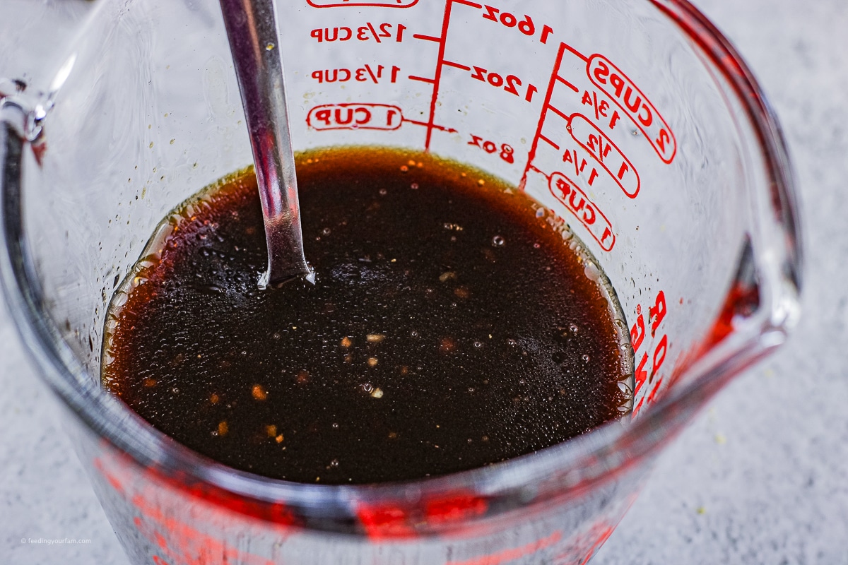 balsamic salad dressing in a measuring cup
