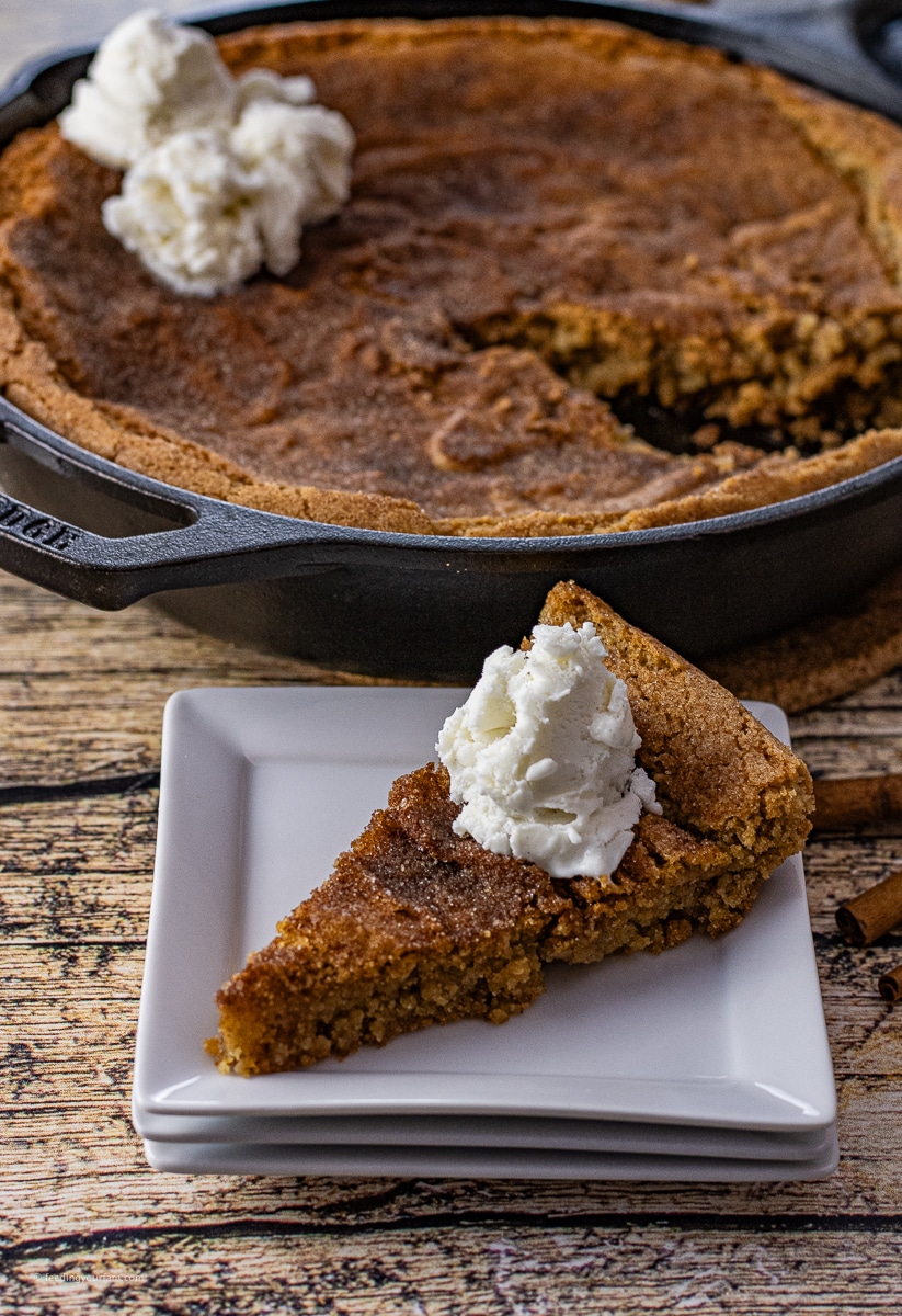 Cast Iron Skillet Snickerdoodle Cookie is one giant snickerdoodle cookie with all of its cinnamon sugar goodness in a soft cookie form. This skillet cookie is easy to make and is perfect for a simple dessert.