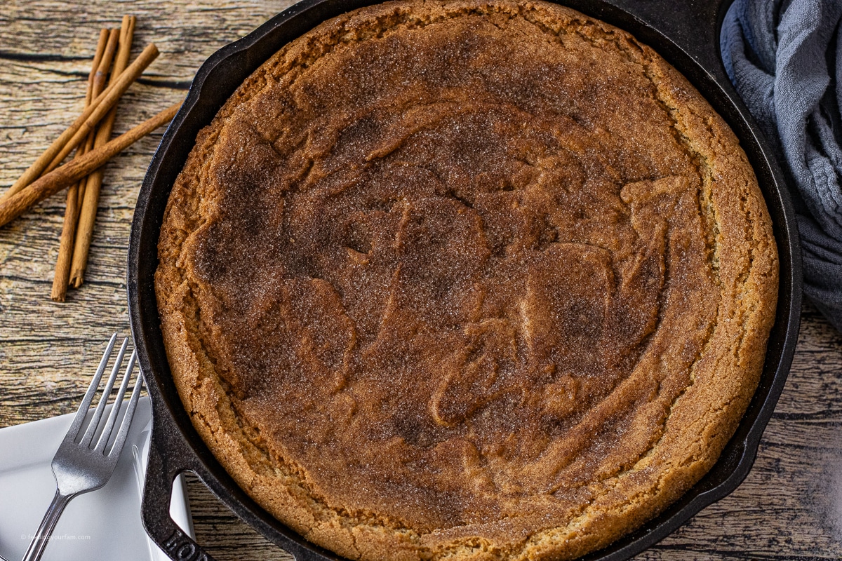 snickerdoodle cookie cake in a cast iron skillet