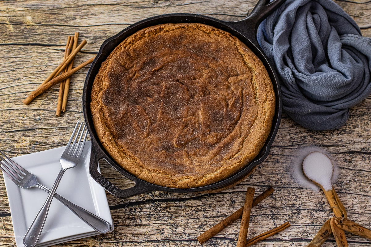 giant snickerdoodle cookie cake in a cast iron skillet