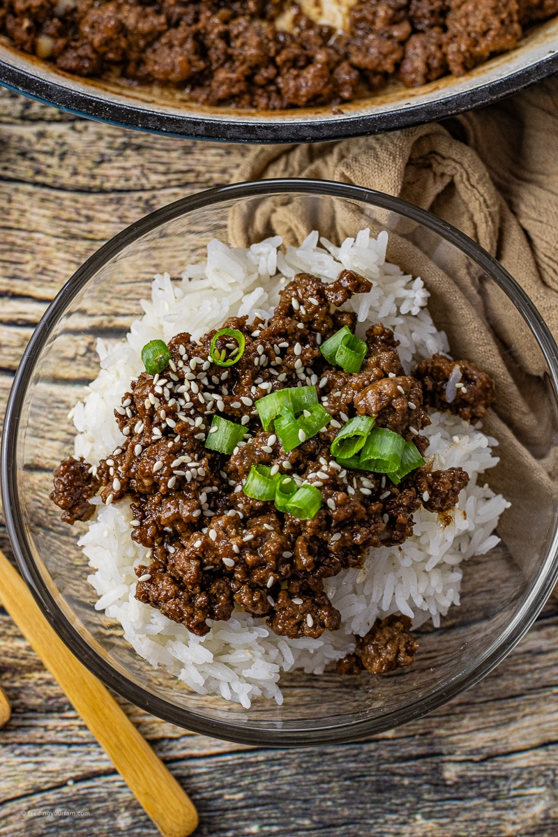 ground beef rice bowls topped with chopped green onions