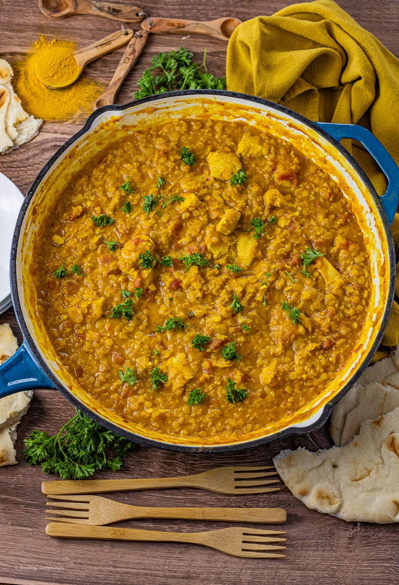 Tender chicken, red lentils, and creamy coconut curry simmer together with simple spices to make this delicious chicken, red lentils, and coconut curry. This one-pot meal is perfect for a comforting dinner or weeknight family meal everyone will love.