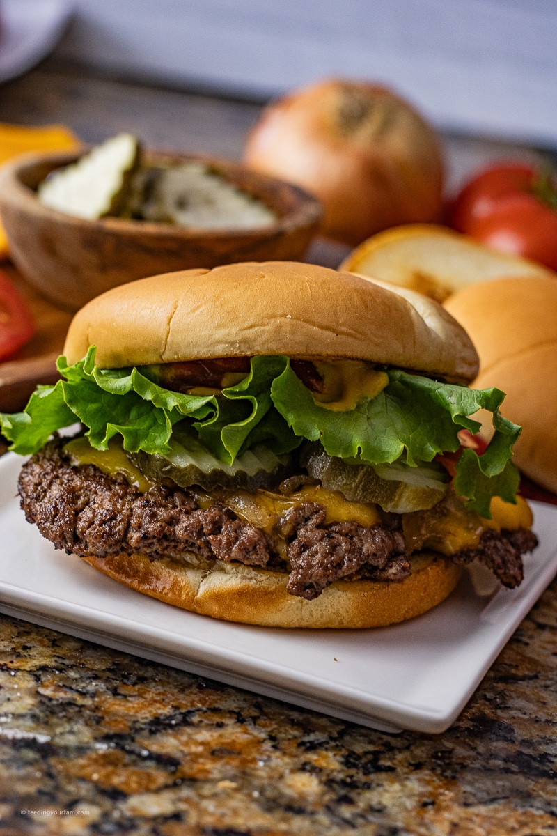 Make crisp, delicious smash burgers right at home on the stovetop in your cast iron skillet.