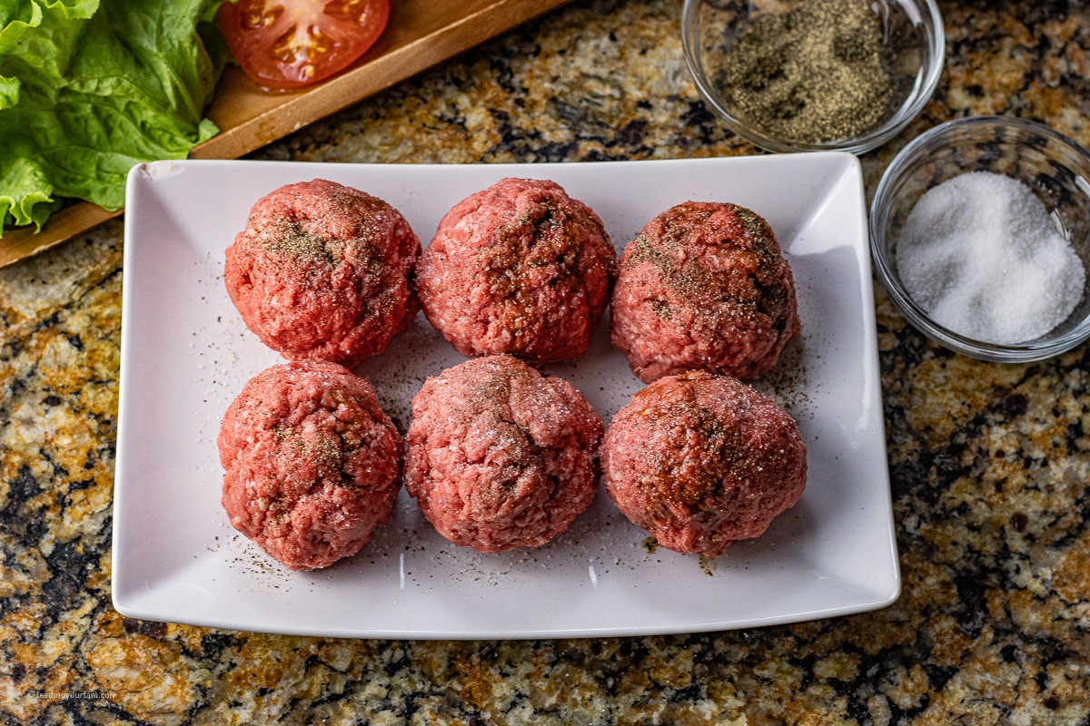 ball of ground beef seasoned with salt and black pepper