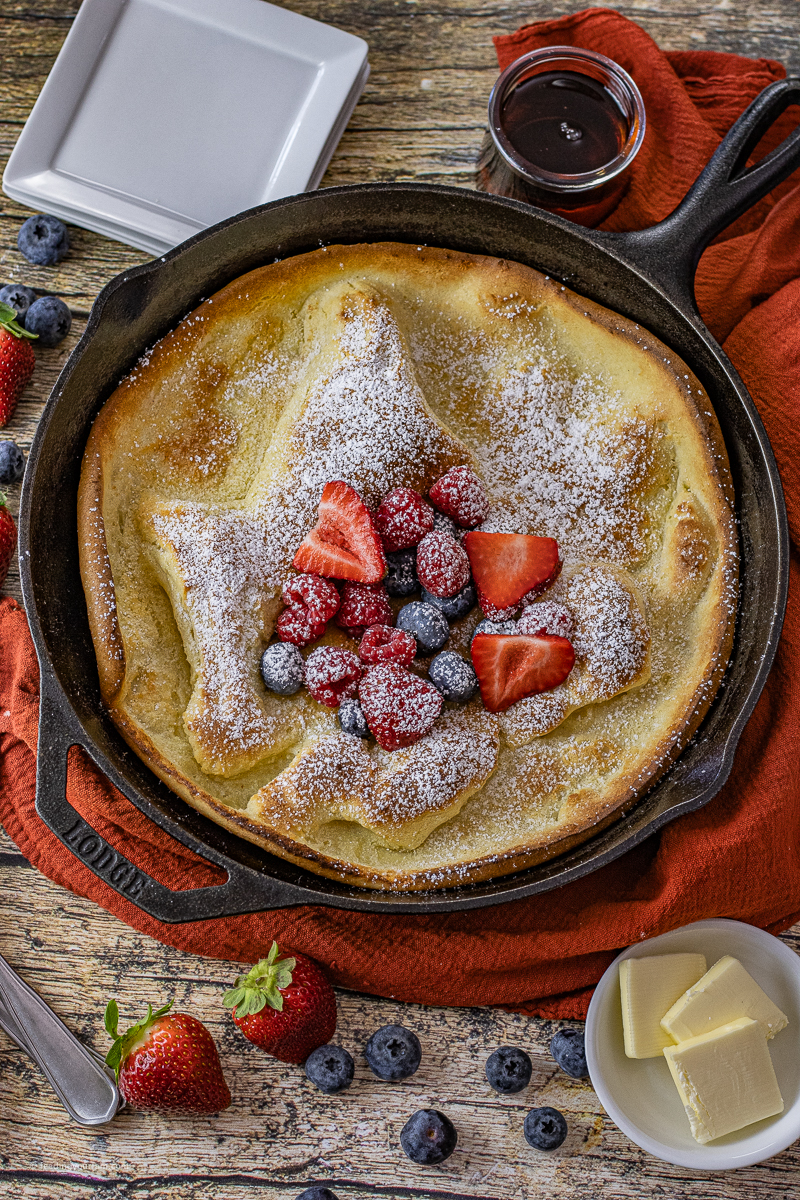 Dutch Baby Recipe in Cast Iron is a fluffy, butter pancake made in one skillet. Made with just a few simple, pantry staple ingredients, this dutch baby pancake can be serve for breakfast, lunch, or dinner.