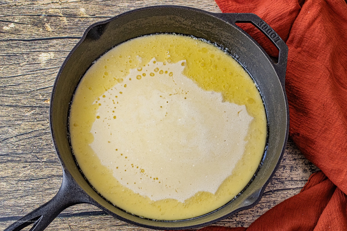 uncooked dutch baby pancake in a cast iron skillet 