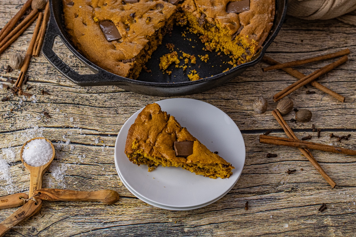 slice of pumpkin chocolate chip cookie on a white plate