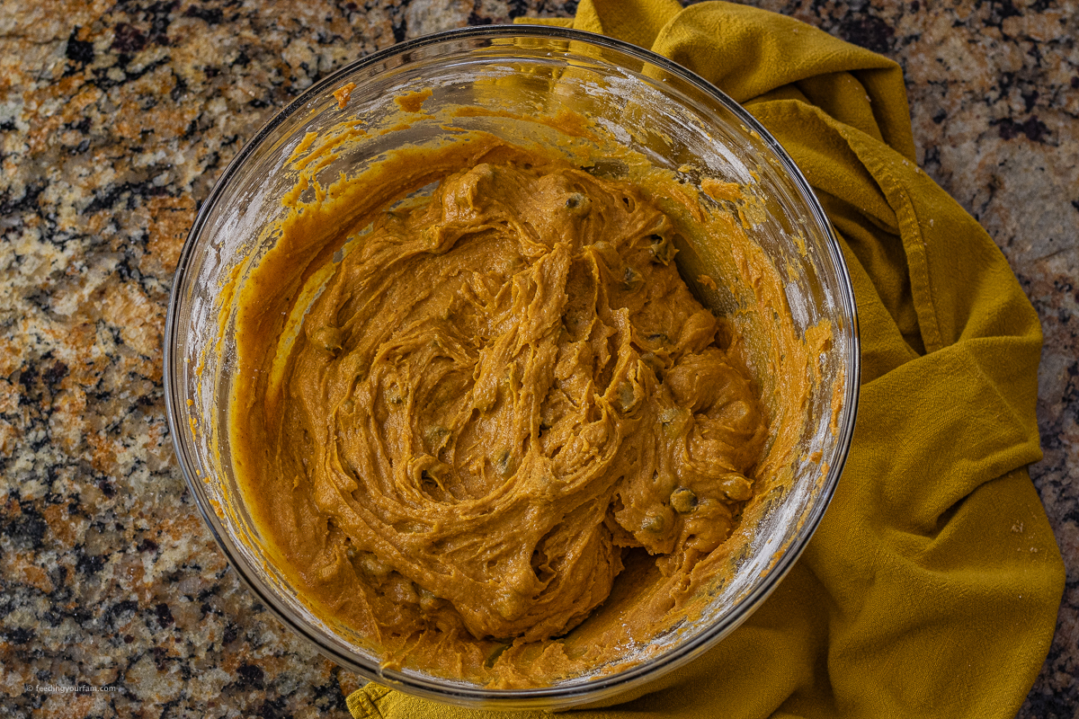 pumpkin chocolate chip cookie dough in a glass mixing bowl