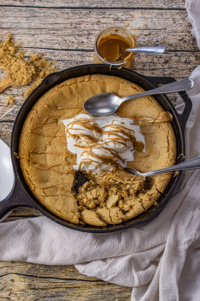 Cast iron skillet peanut butter cookie is a massive, melt-in-your-mouth treat with crispy edges and a gooey, buttery center. It's so irresistible, you'll have everyone coming back for seconds....and thirds!