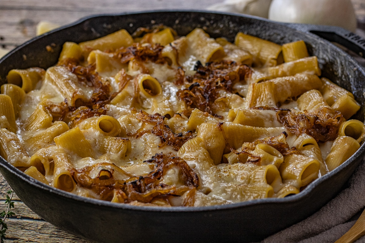 big cast iron skillet of french onion pasta