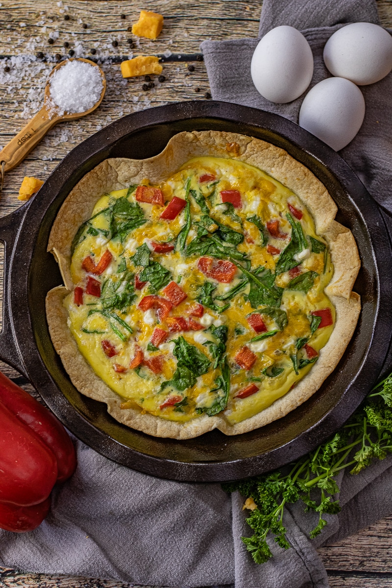 Tortilla Egg Bake is the perfect breakfast, full of eggs, vegetables, cottage cheese, and cheddar cheese all baked in a crispy tortilla shell.